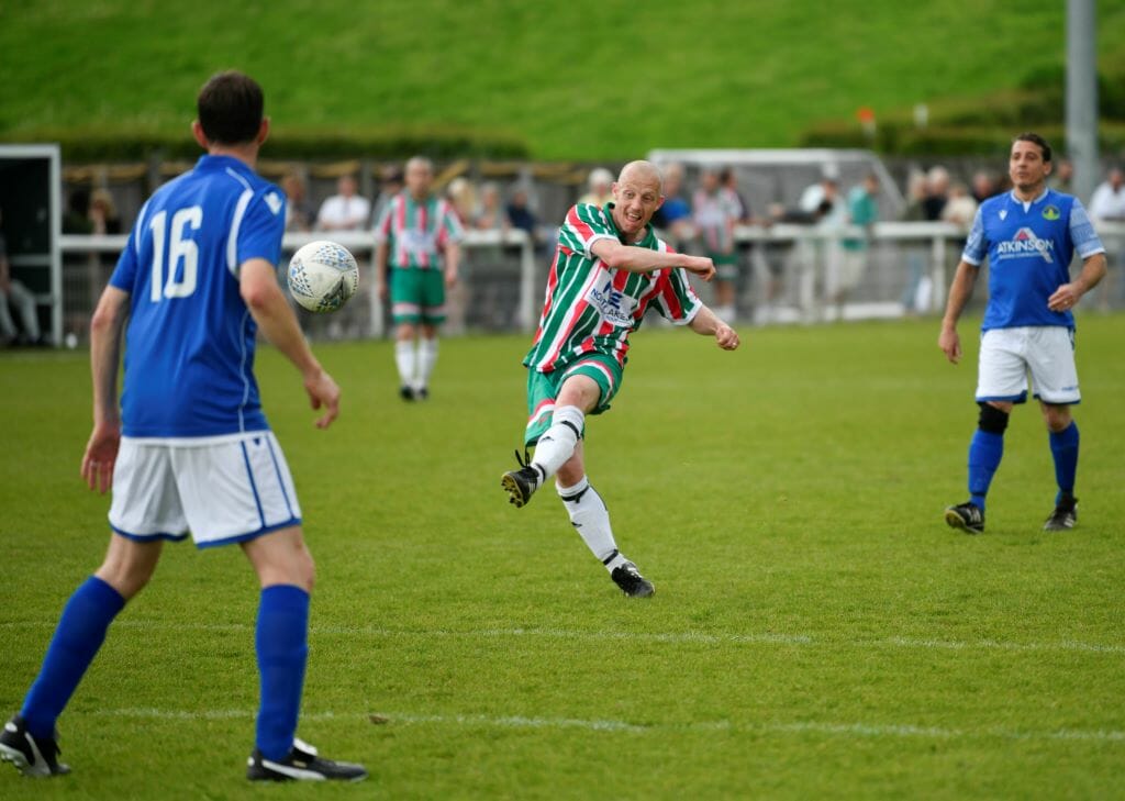 Footballer taking a shot on goal